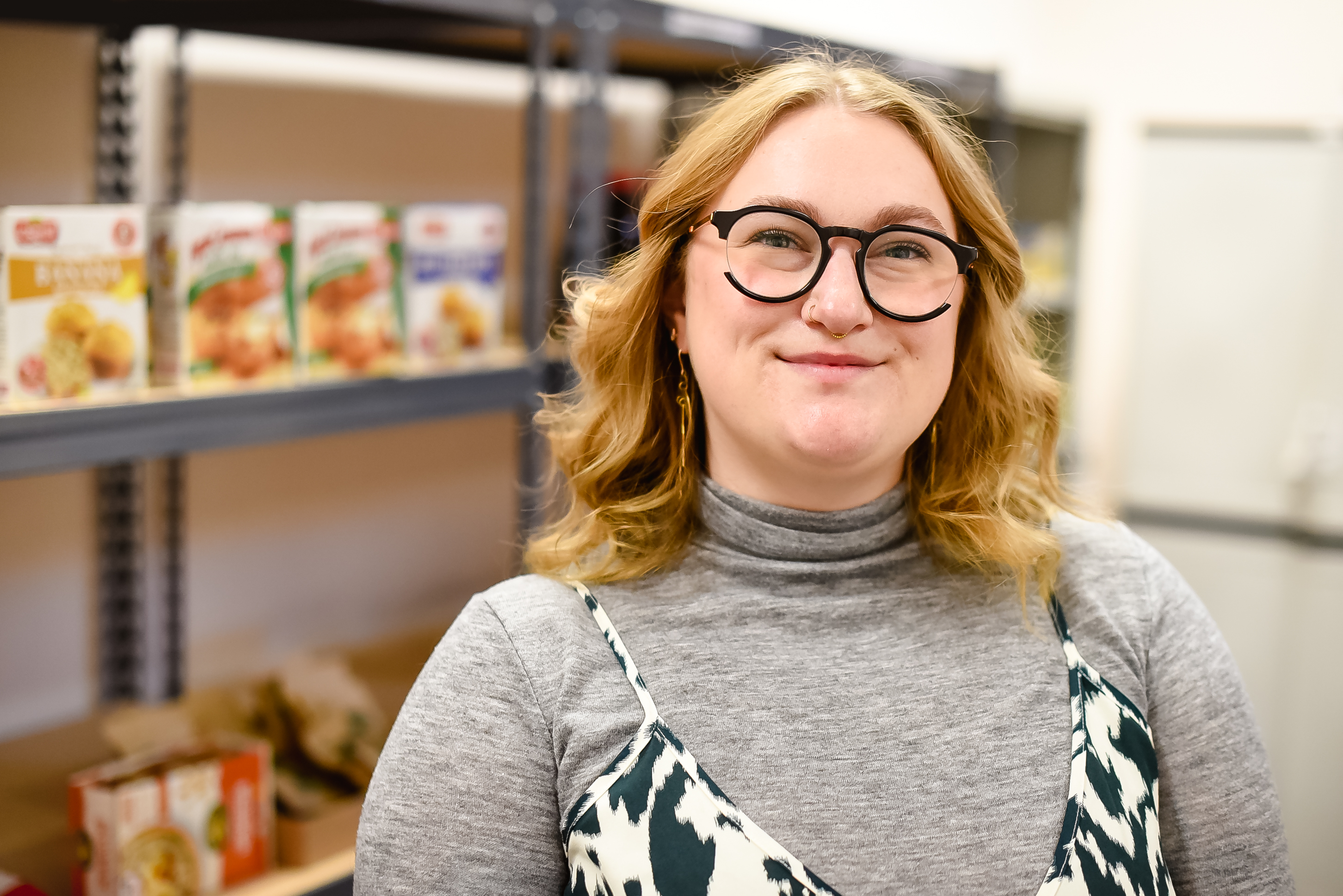 UM Alum Kat Cowley in the UM Food Pantry.