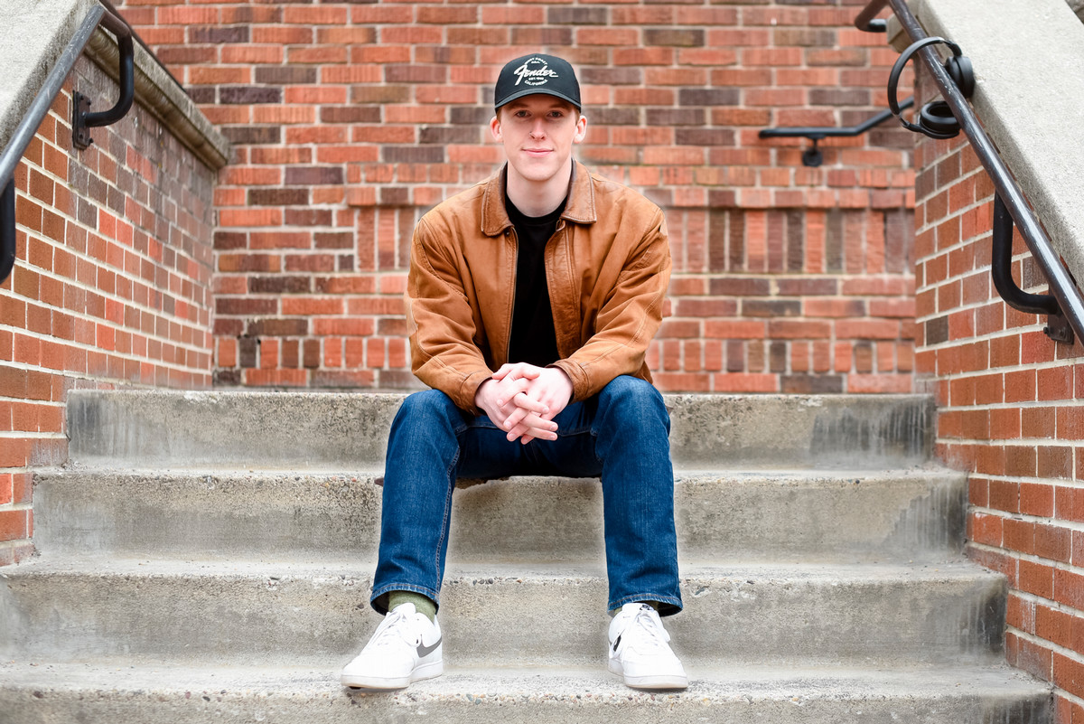 Photo of Jack Person, on the steps of UM's Brantly Hall