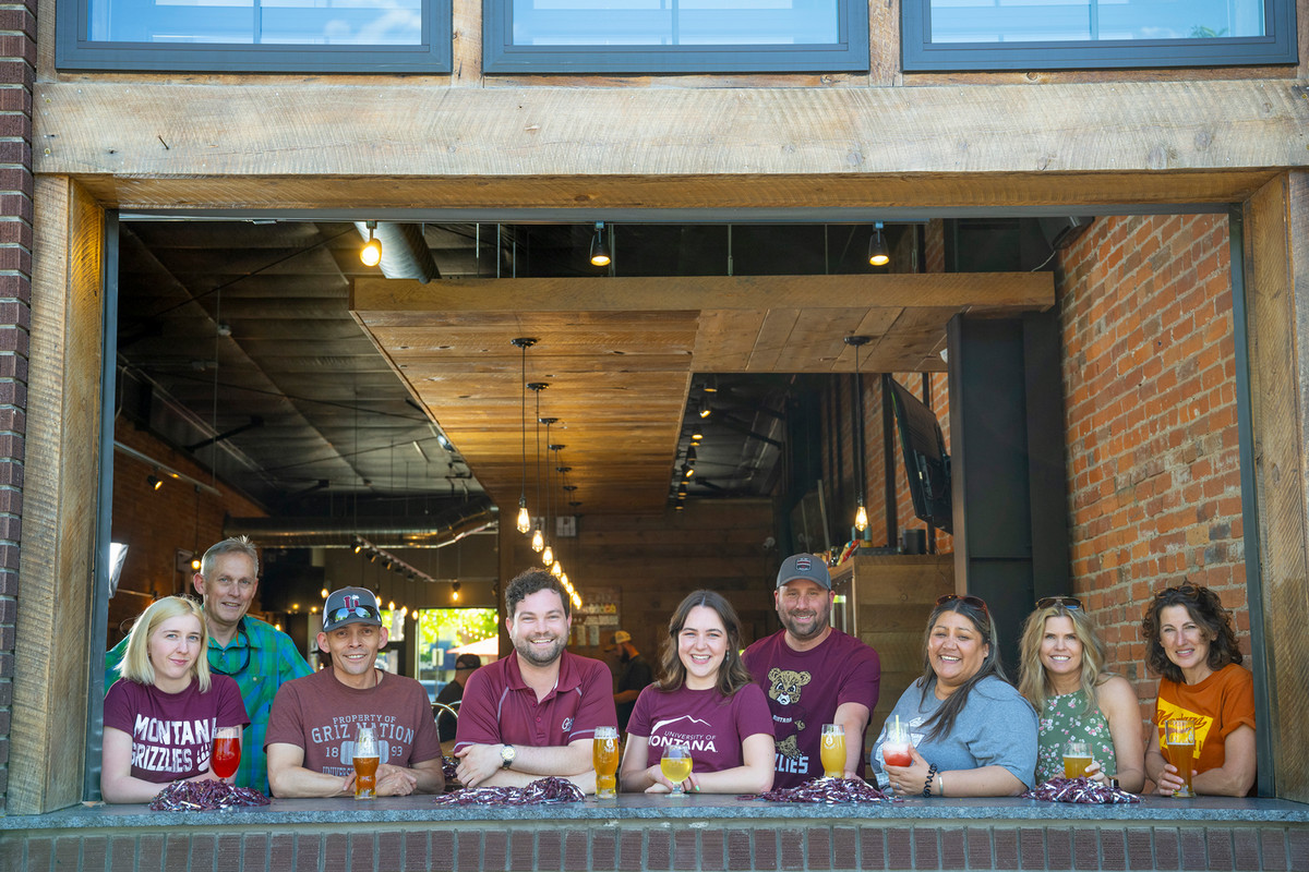 Group of Griz alums gathered at a local brewery.