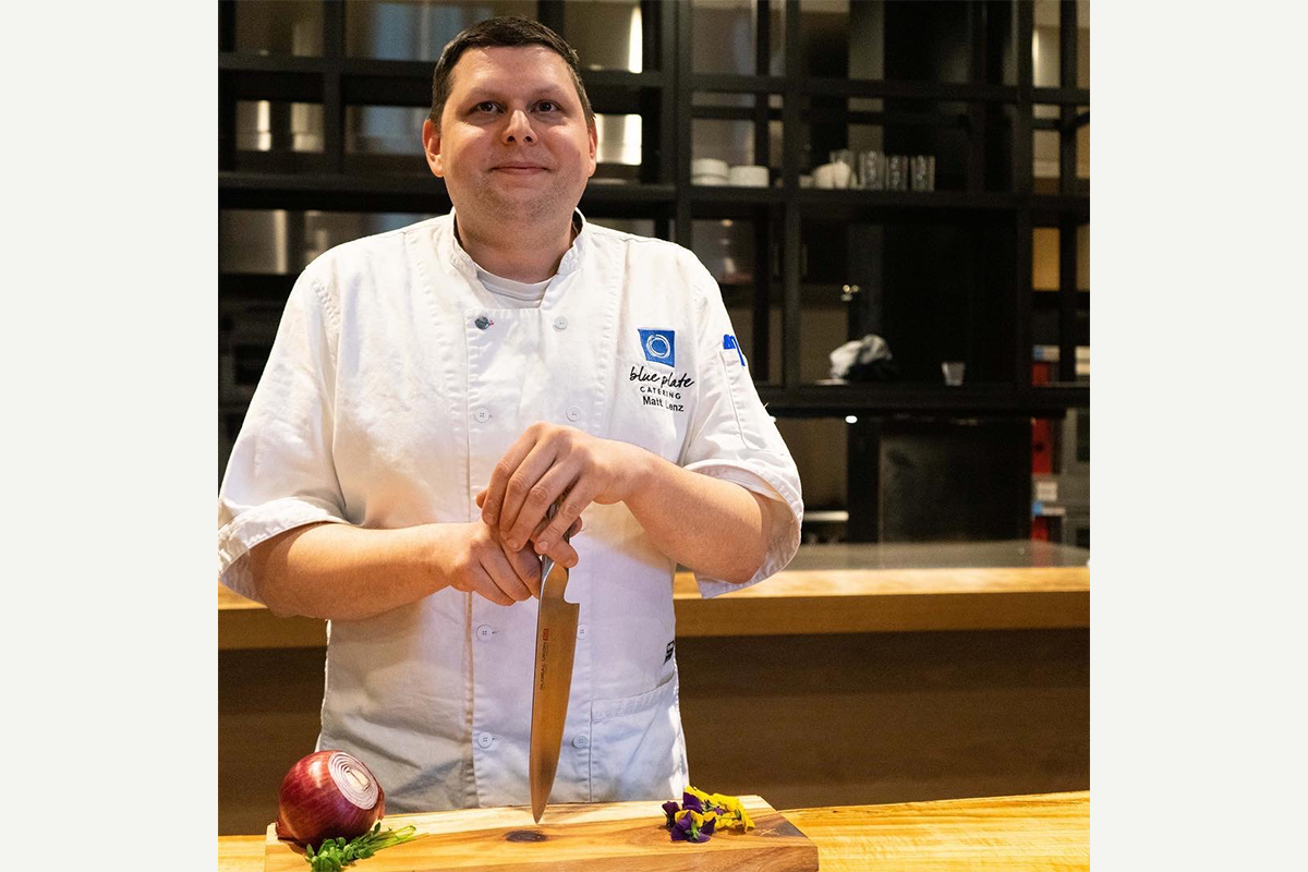 Matthew Lenz stands in a kitchen. He has experience at every level of food production. From the kitchen table to large banquet halls and, now, to the production floor.