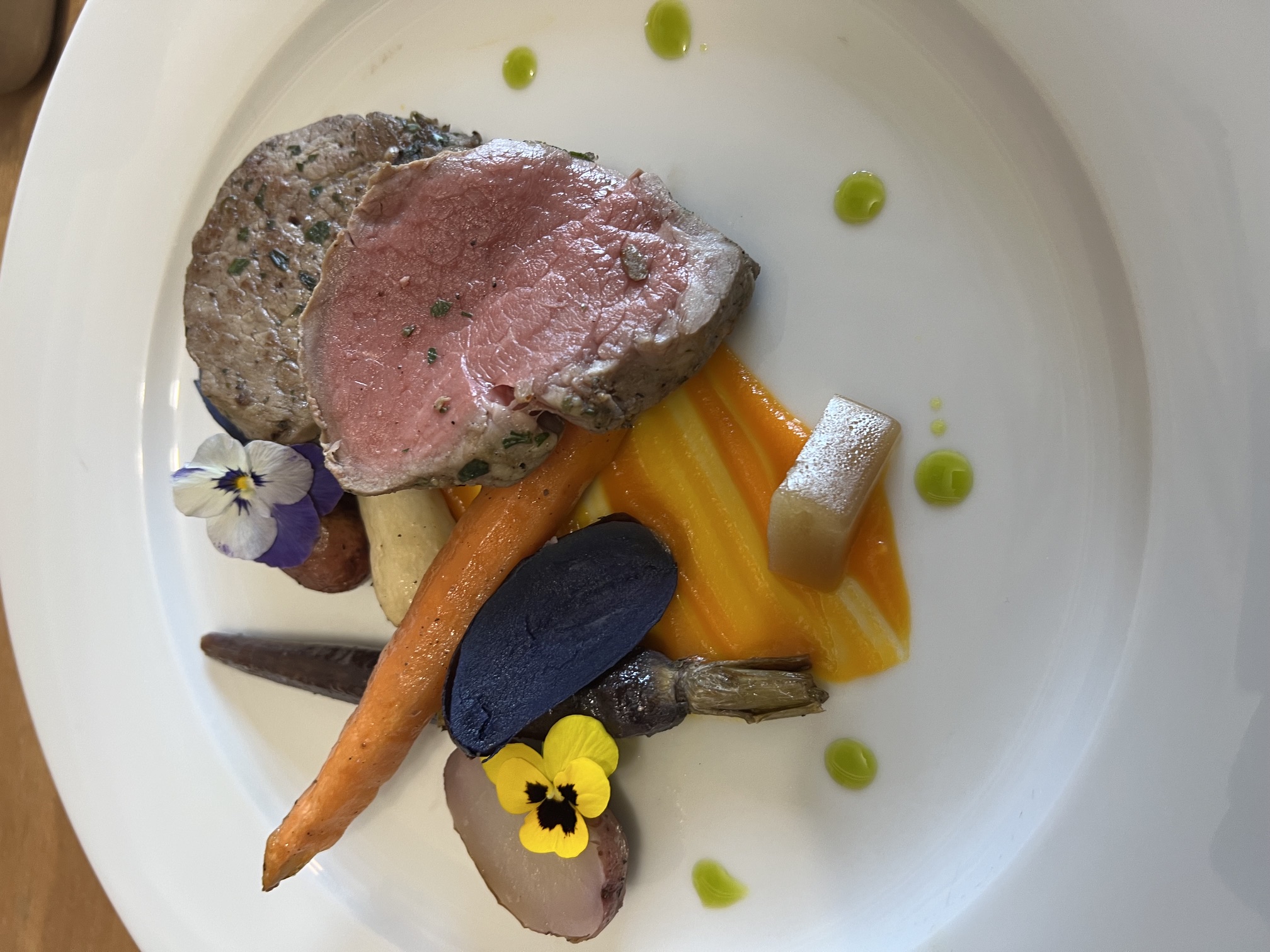 Plated entrée with sliced medium-rare meat, roasted carrots and potatoes prepared by Matthew Lenz. (Photo courtesy of Matthew Lenz)